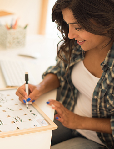 Woman working on calendar plan