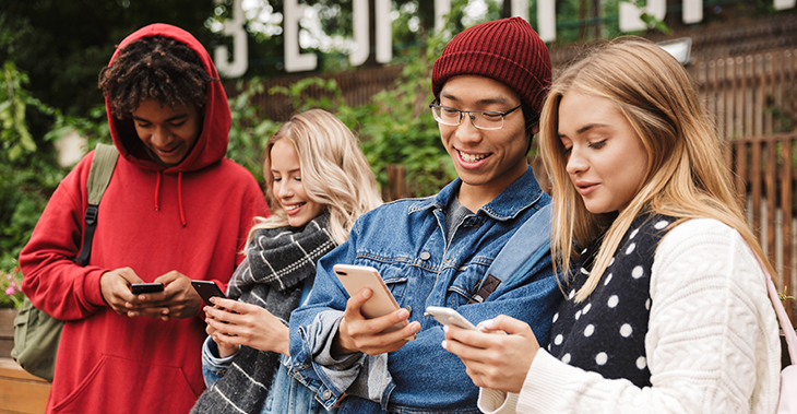 Everlytic How to Communicate with Different Generations via Email | Middle aged man working on laptop | Group of Gen Zers using smart phones | Email Communication