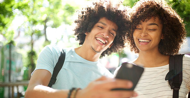 How to Segment Your eCommerce Email Lists in Everlytic | A young couple looking at a smart phone