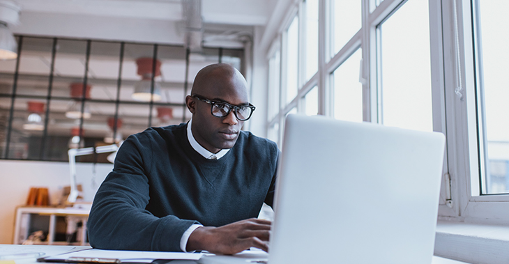 Everlytic | Blog | Launch Your Next Product or Service with the Sideways Sales Letter | Blog Image | African Male Working on Laptop