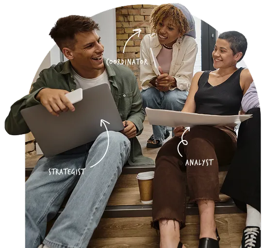 three people sitting on stairs with their laptops discussing how to build an email marketing campaign
