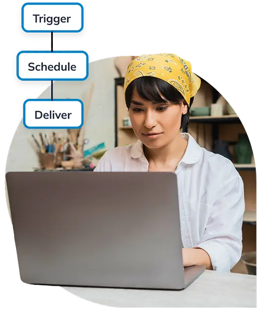 A lady sitting in front of a computer sreen.