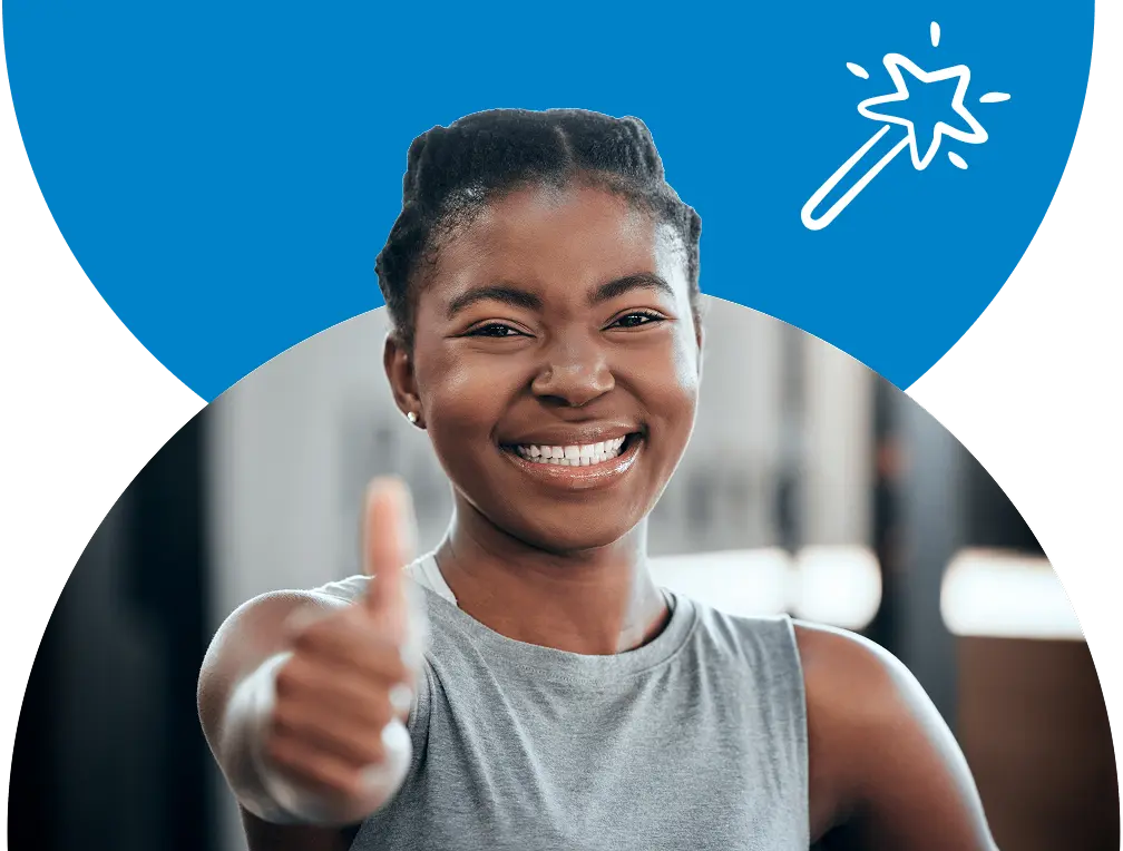 A lady smiling and giving a thumbs up.