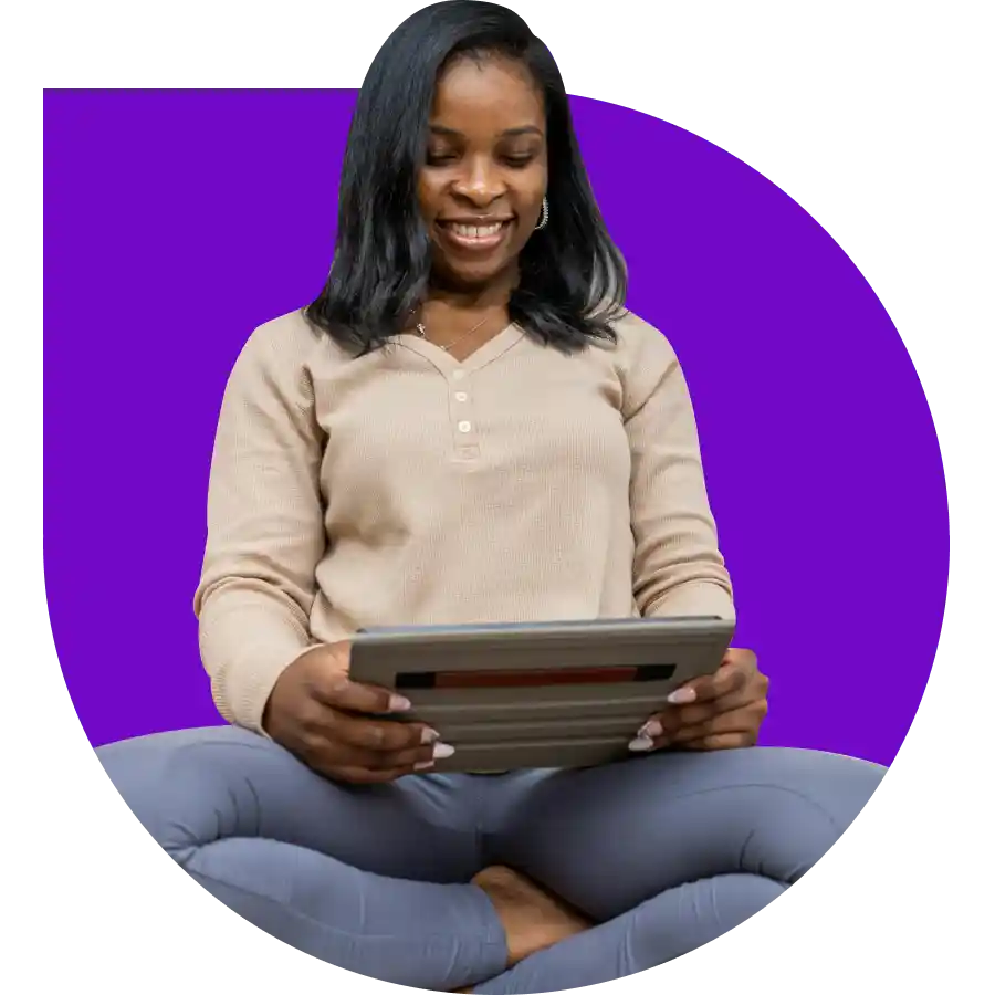 a women holding her tablet