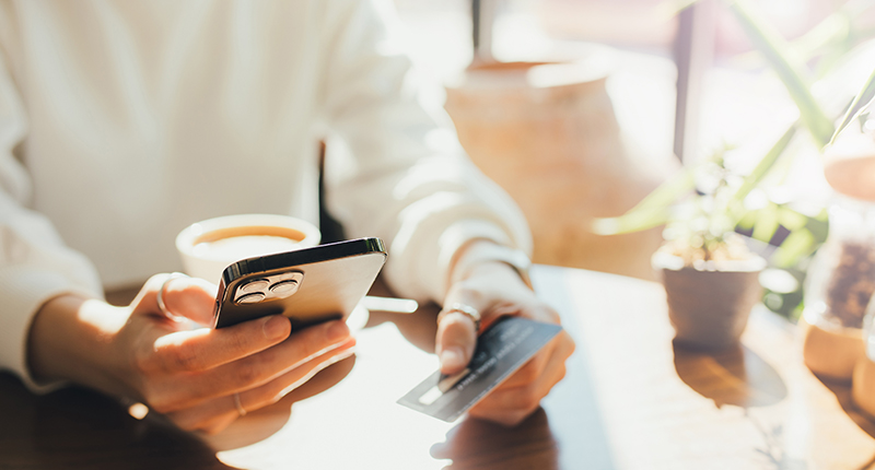 Your 2023 Black Friday Email To-Do List_Everlytic Blog_Person Holding Cell Phone and Credit Card