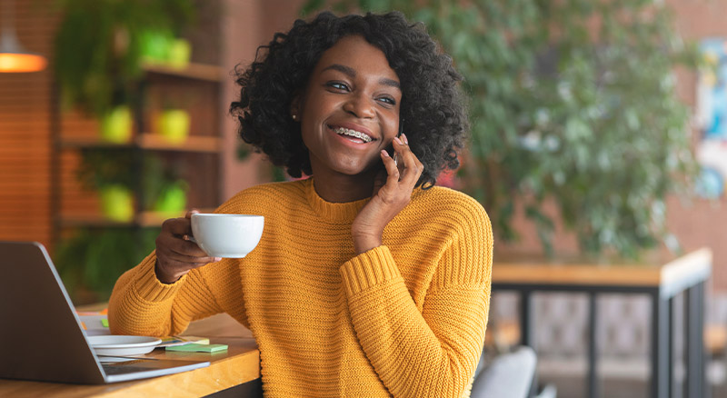 5 Bulk Email Marketing Mistakes & How to Avoid Them | Everlytic | Email Marketing | Bulk Email | Woman Having Coffee and Chatting on Phone