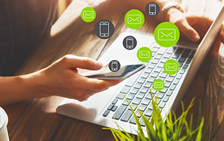 Your 9 Favourite Pieces of Everlytic Content from 2022 | Everlytic | Email marketing | Marketing automation | Bulk Communication | Laptop and mobile on desk