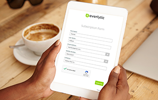 Your 9 Favourite Pieces of Everlytic Content from 2022 | Everlytic | Email marketing | Marketing automation | Bulk Communication | Subscription forms | Person looking at tablet screen